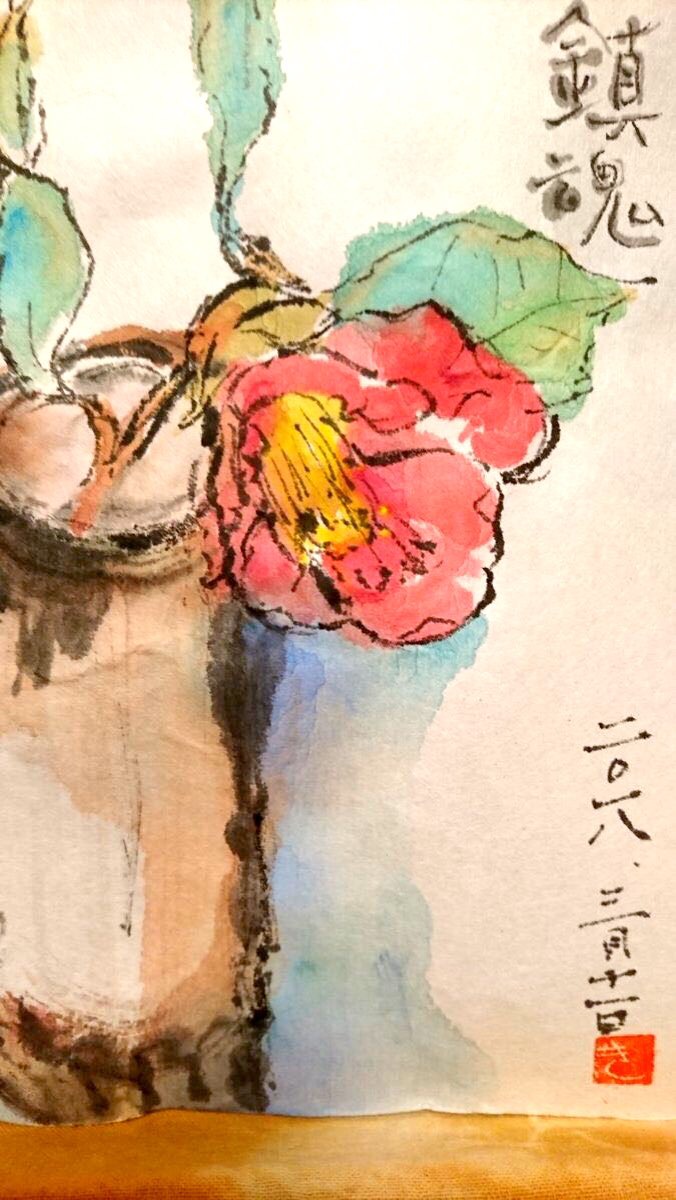 花瓶に挿した赤い椿の花