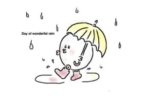 傘をさして雨の中を歩く