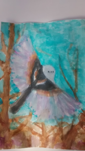 飛ぶシマエナガ